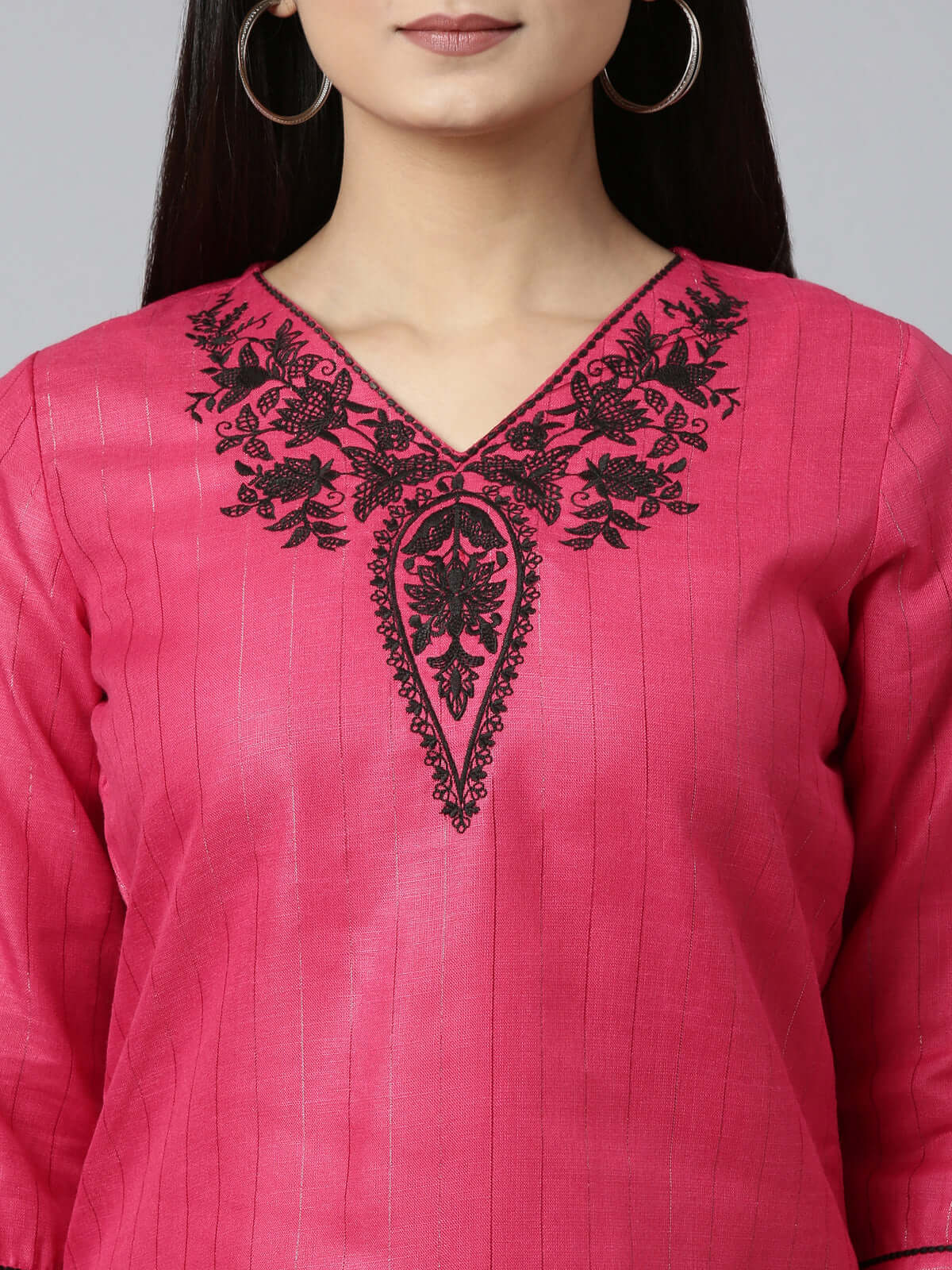 CLOSEUP IMAGE OF DARK PINK SHORT KURTI WITH NECK AND SLEEVE EMBROIDERY FROM SAMHITAS APPAREL