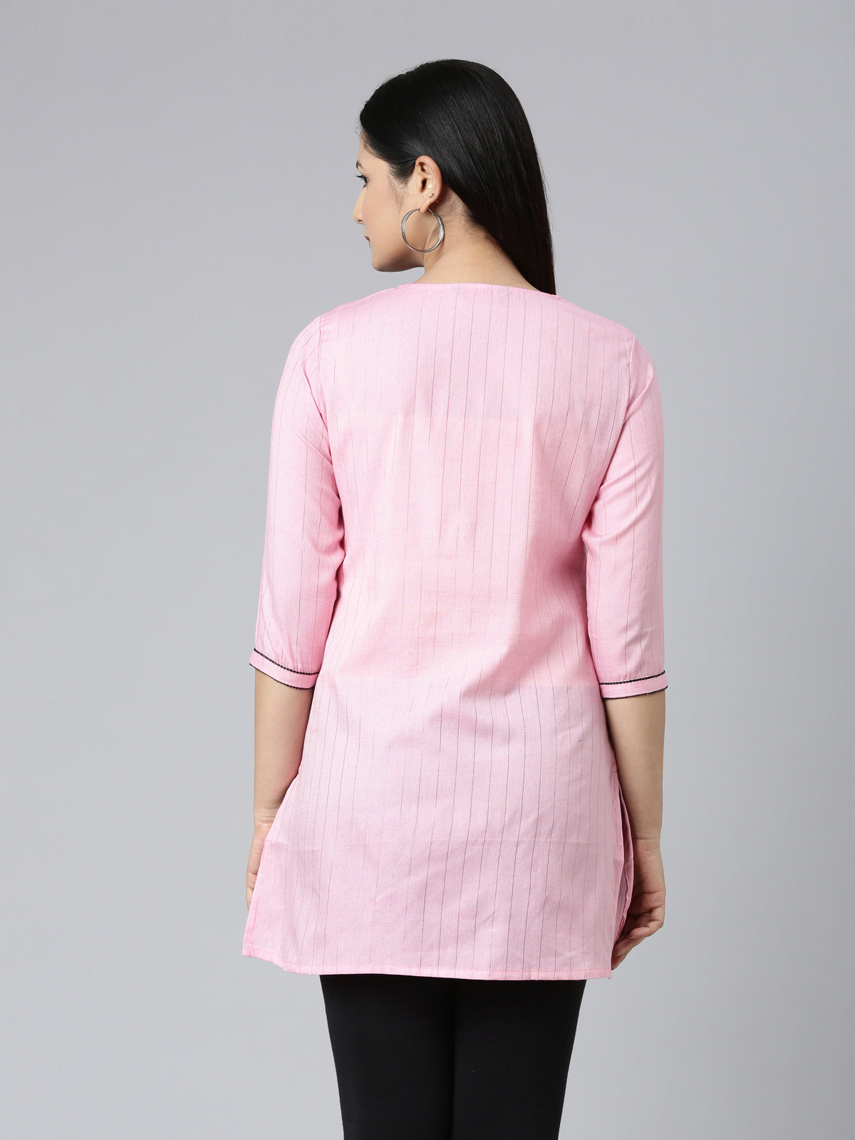 BACK SIDE VIEW OF SAMHITAS BABY PINK SHORT KURTI WITH NECK AND SLEEVE EMBROIDERY