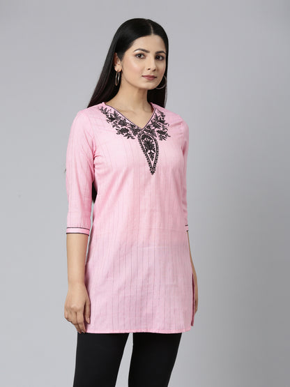 SIDE VIEW OF SAMHITAS BABY PINK SHORT KURTI WITH NECK AND SLEEVE EMBROIDERY