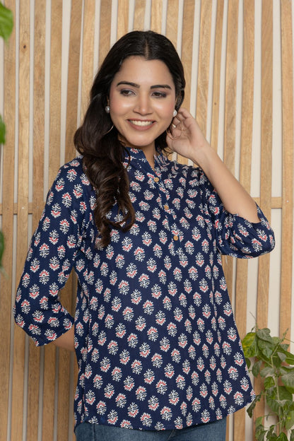 V- NECK INDIGO COLOR SHORT KURTI WITH WHITE&RED ABSTRACT PRINT, WITH FALSE BUTTONS AT NECK AND REGULAR 3/4th SLEEVE WITH ROUND HEAM LINE