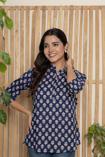 V- NECK INDIGO COLOR SHORT KURTI WITH WHITE&RED ABSTRACT PRINT, WITH FALSE BUTTONS AT NECK AND REGULAR 3/4th SLEEVE WITH ROUND HEAM LINE