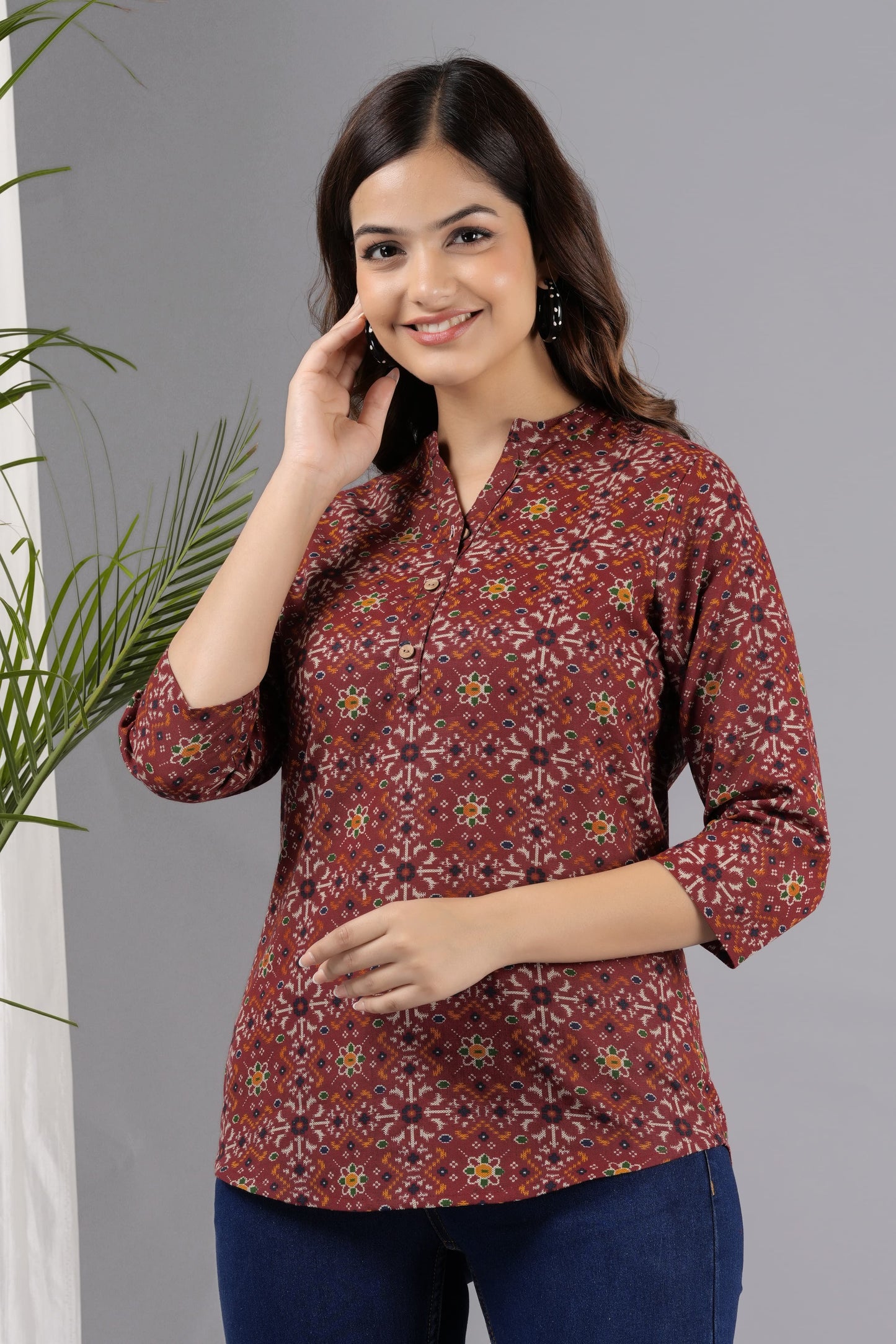 V- NECK CHERRY RED COLOR SHORT KURTI WITH BANDHANI STYLE FLORAL PRINT, WITH FALSE BUTTONS AT NECK