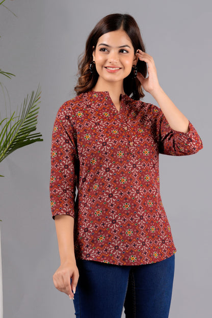 V- NECK CHERRY RED COLOR SHORT KURTI WITH BANDHANI STYLE FLORAL PRINT, WITH FALSE BUTTONS AT NECK