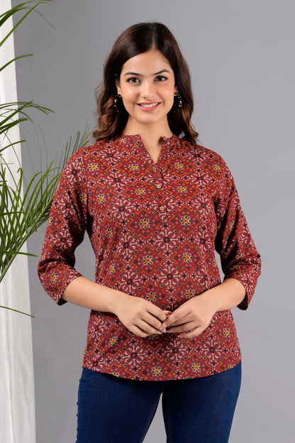 V- NECK CHERRY RED COLOR SHORT KURTI WITH BANDHANI STYLE FLORAL PRINT, WITH FALSE BUTTONS AT NECK