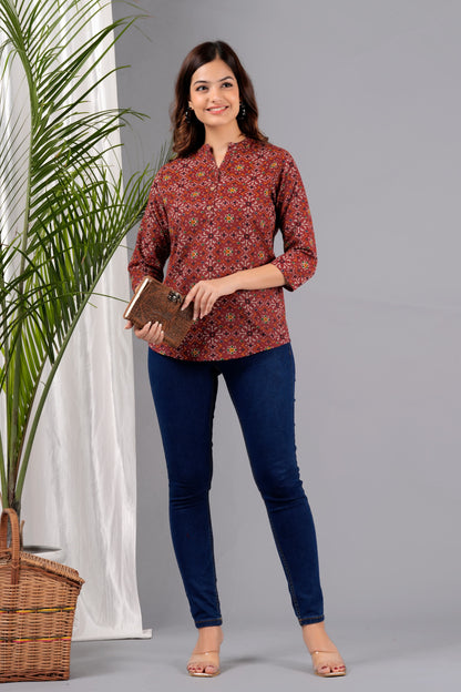 V- NECK CHERRY RED COLOR SHORT KURTI WITH BANDHANI STYLE FLORAL PRINT, WITH FALSE BUTTONS AT NECK