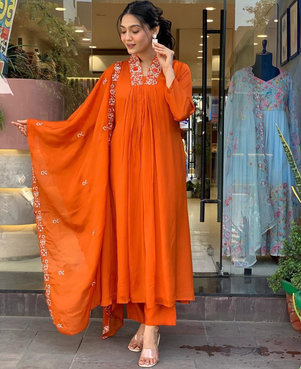 Beautiful Suit Set Decorated With Solid Orange Color Fabric And Floral Embroidery At Neck